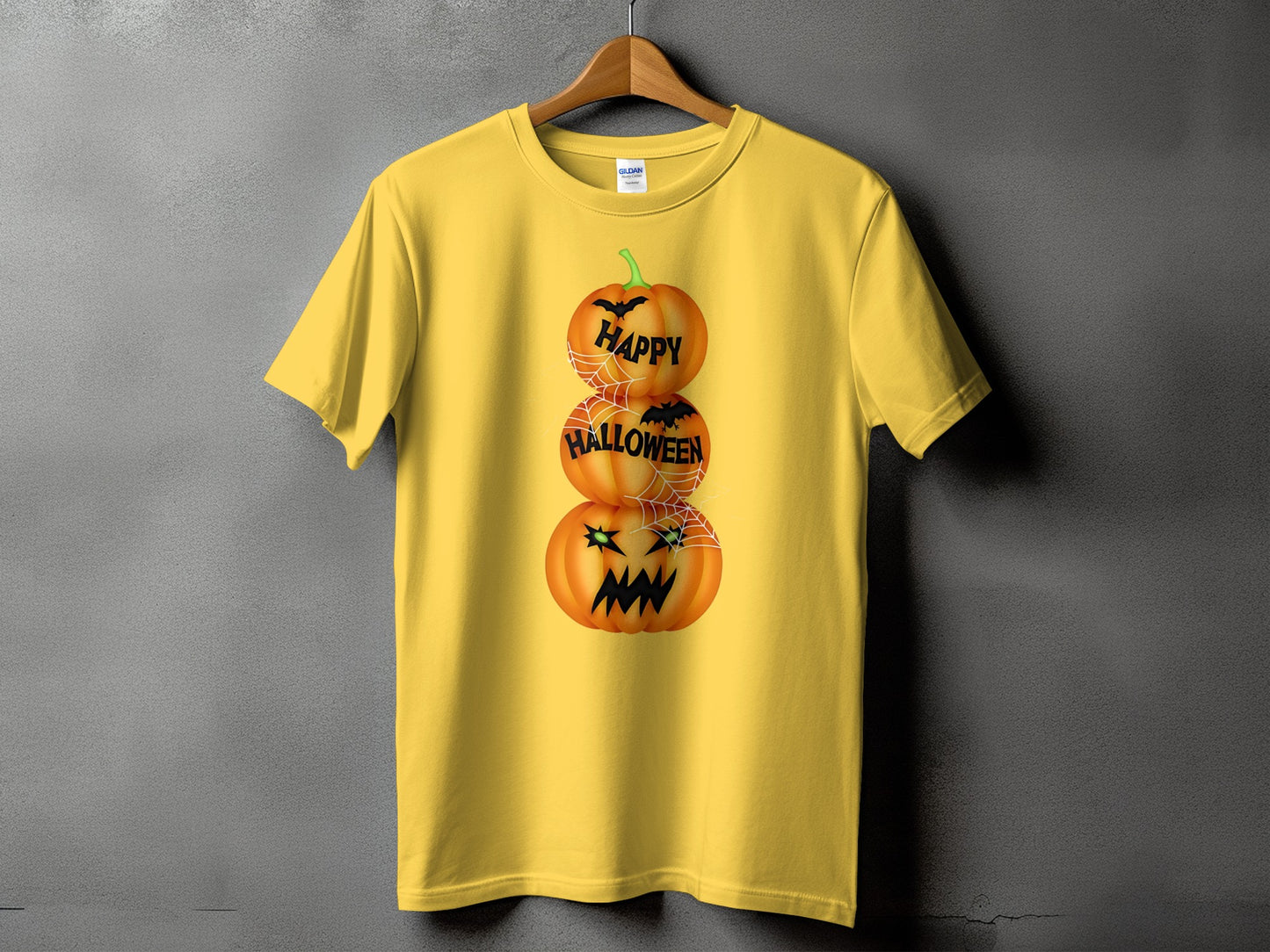Yellow t-shirt with stacked Halloween pumpkins and text.