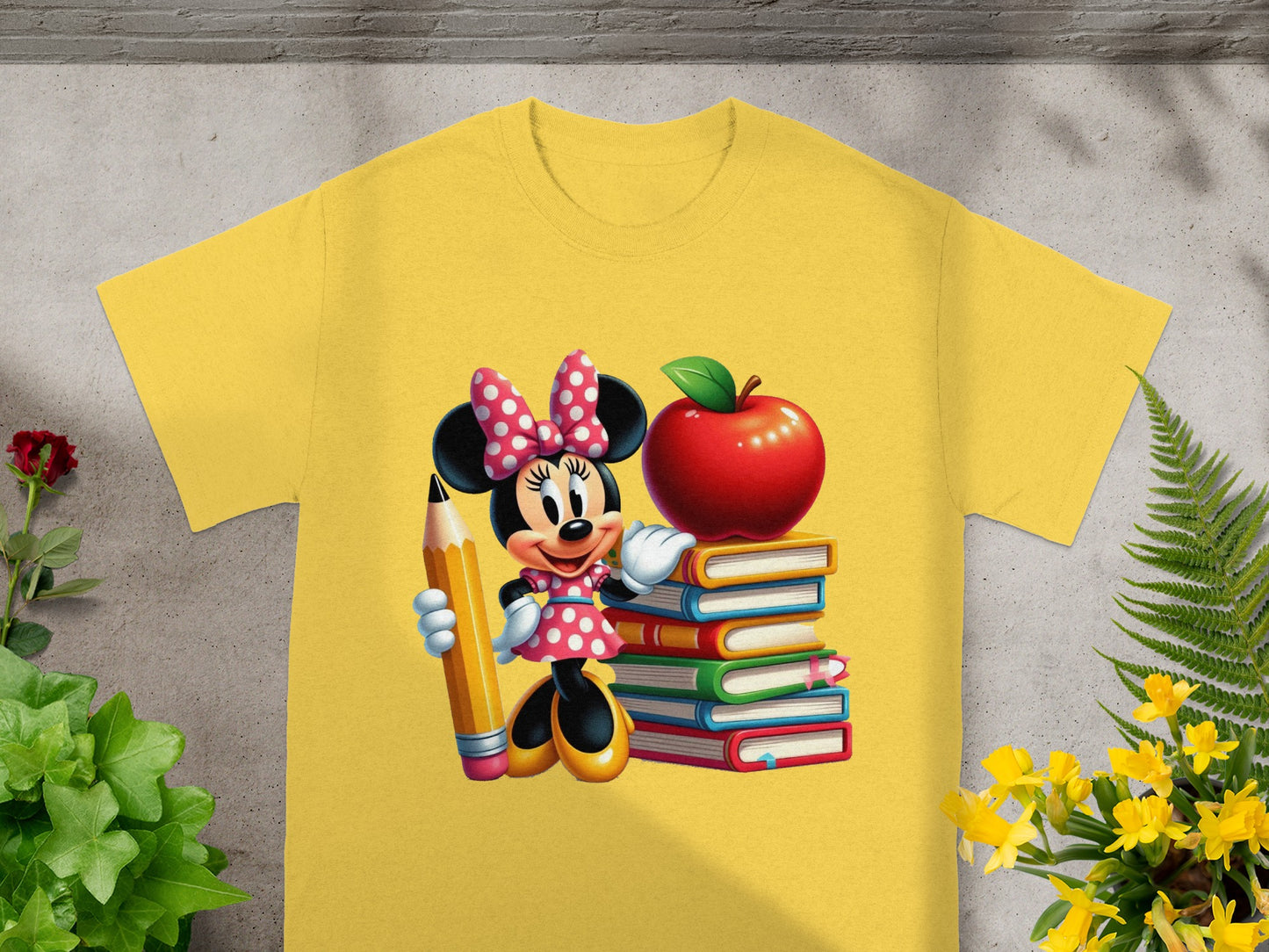 Minnie Mouse holding a pencil next to a stack of books with an apple on top.