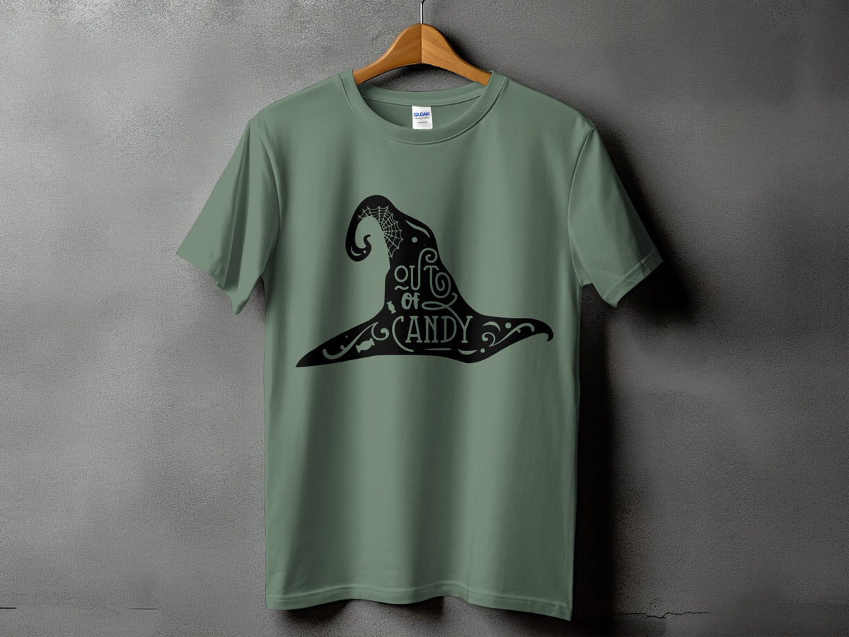 Green t-shirt with black witch hat graphic saying "out of candy"