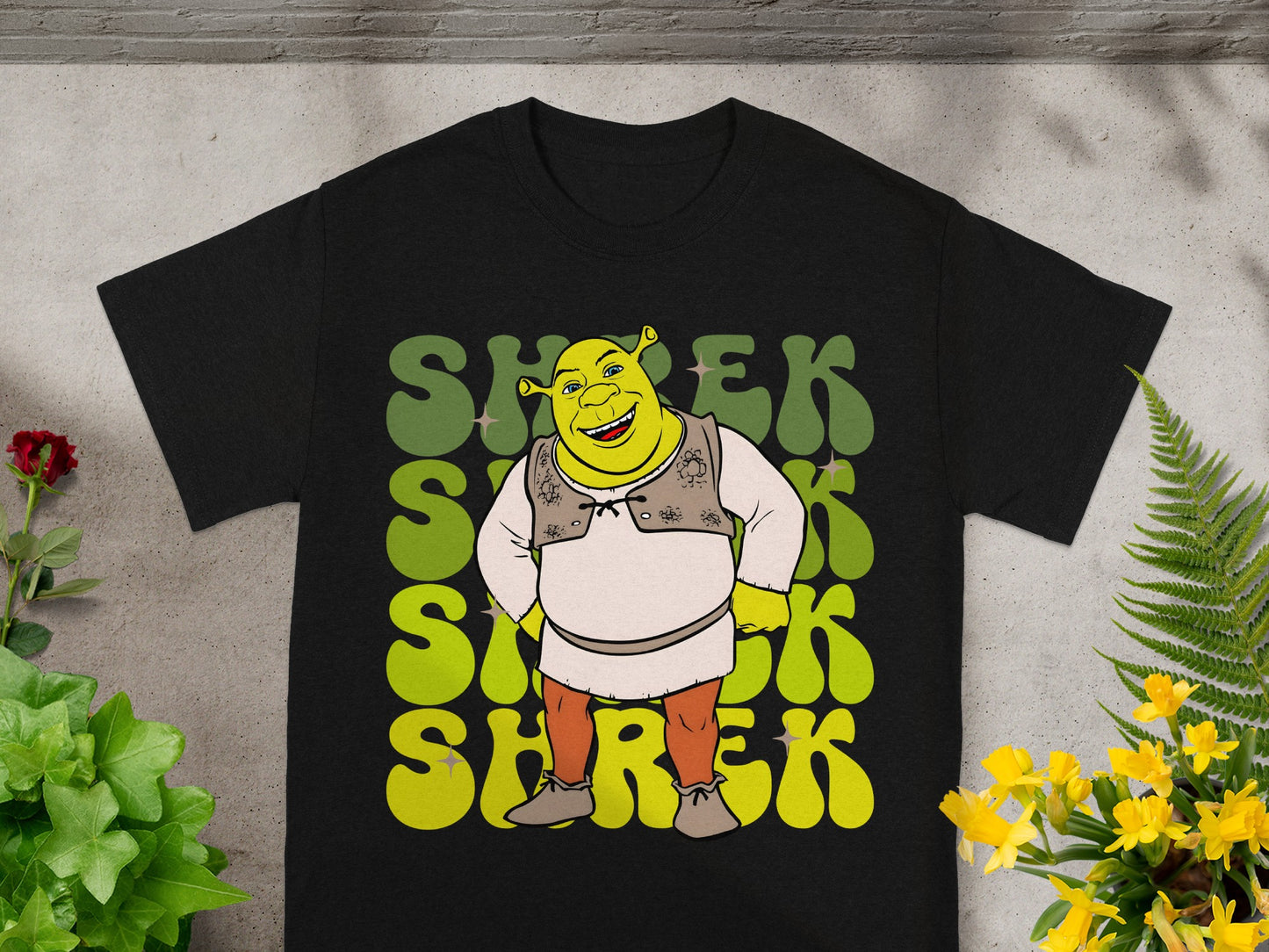 Black t-shirt with Shrek character and "SHREK" text in green.