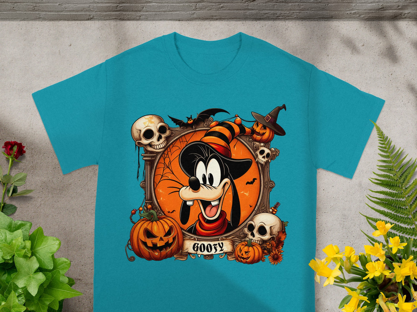 Goofy in a Halloween-themed graphic with skulls, pumpkins, and bats.