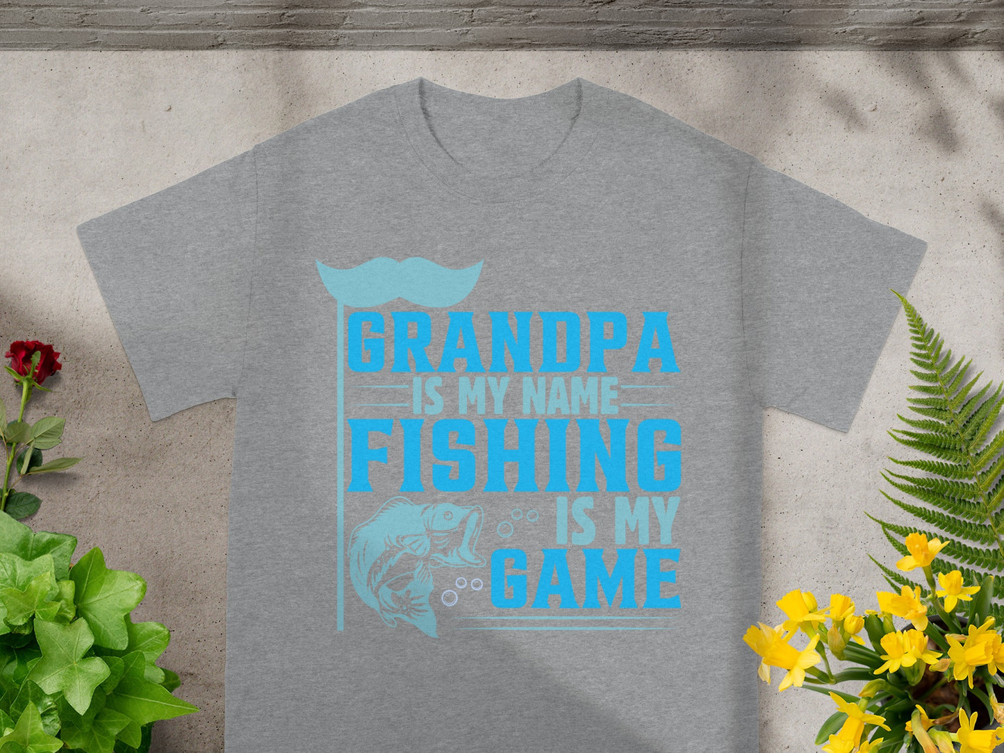 Gray t-shirt with blue text "Grandpa is my name, fishing is my game" and fish graphic.