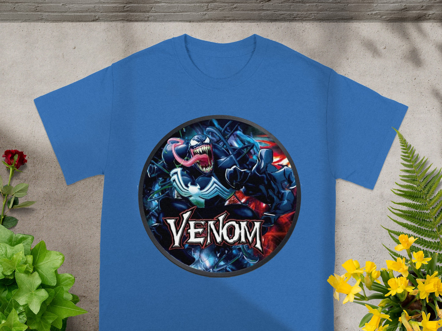 Blue t-shirt featuring Venom from Marvel Comics with his name below.