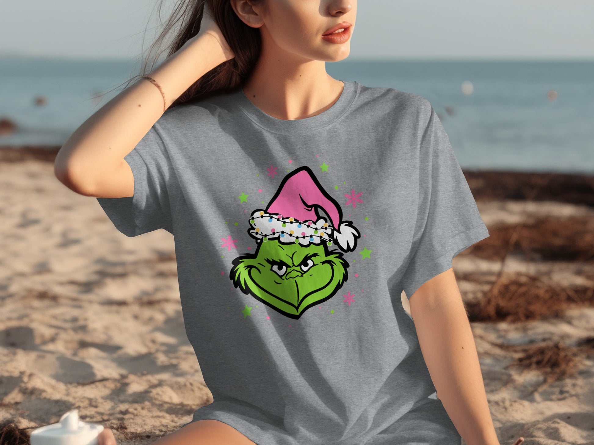 Festive Grinch Face in Pink Santa Hat T-shirt