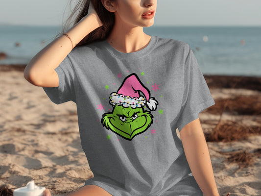 Festive Grinch Face in Pink Santa Hat T-shirt