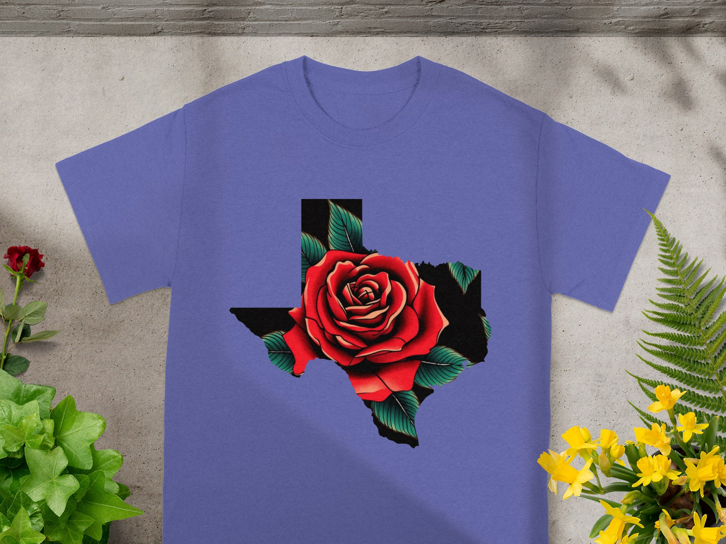 Purple t-shirt with Texas outline filled with a red rose and green leaves.
