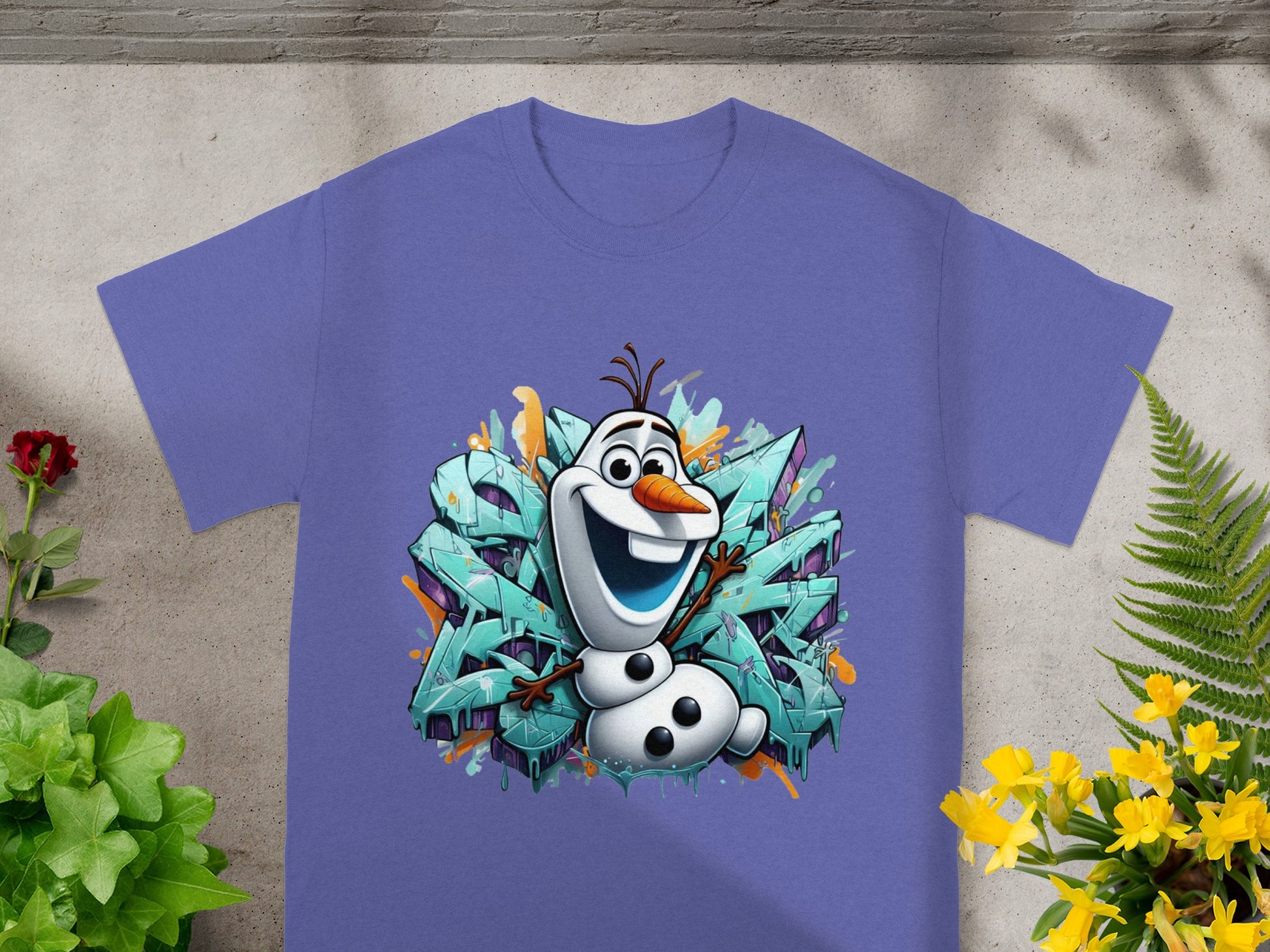 Purple t-shirt with Olaf the snowman against colorful graffiti.