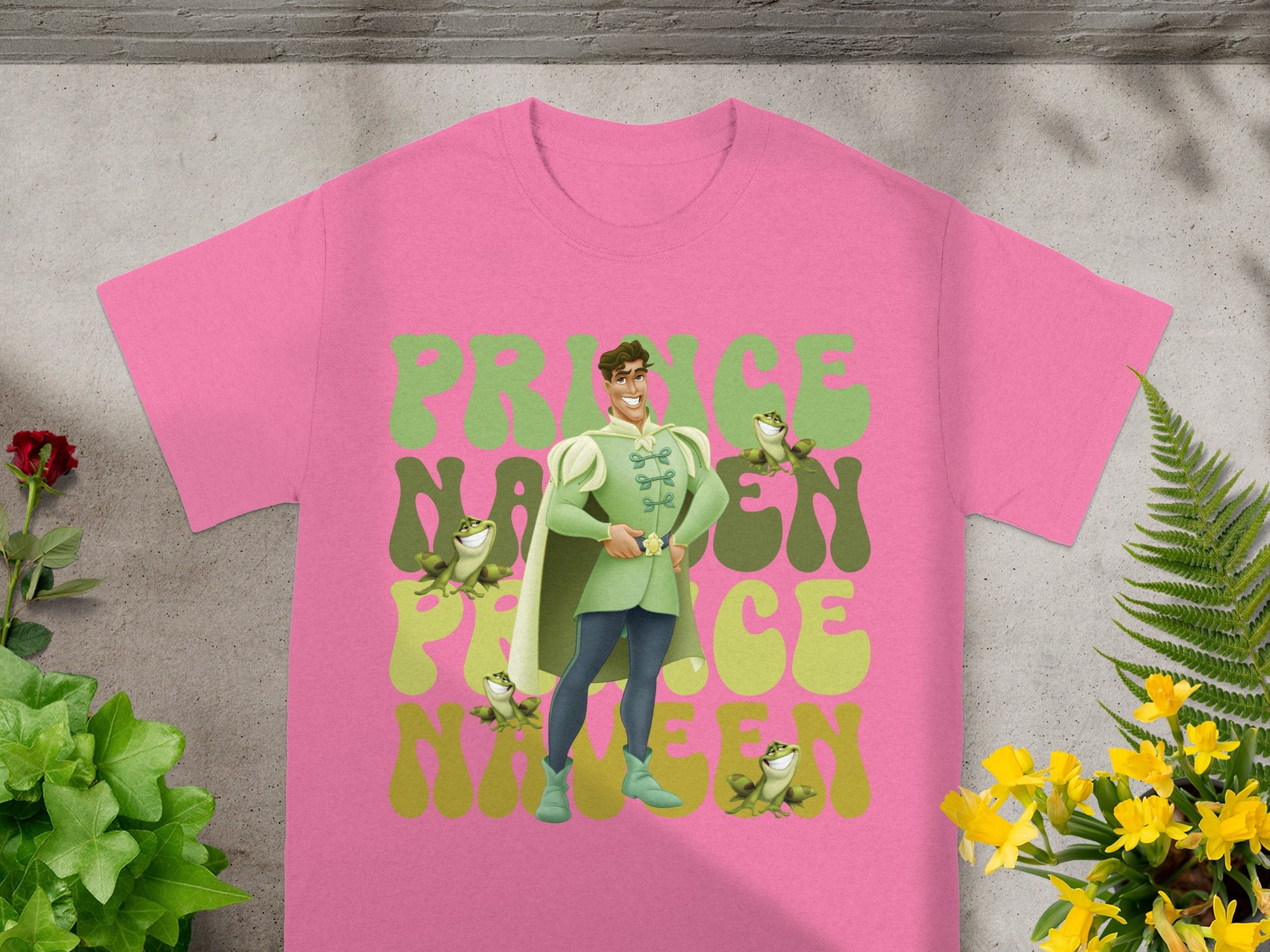 Pink t-shirt with Prince Naveen and frog graphic, "Prince Naveen Fifteen" text.