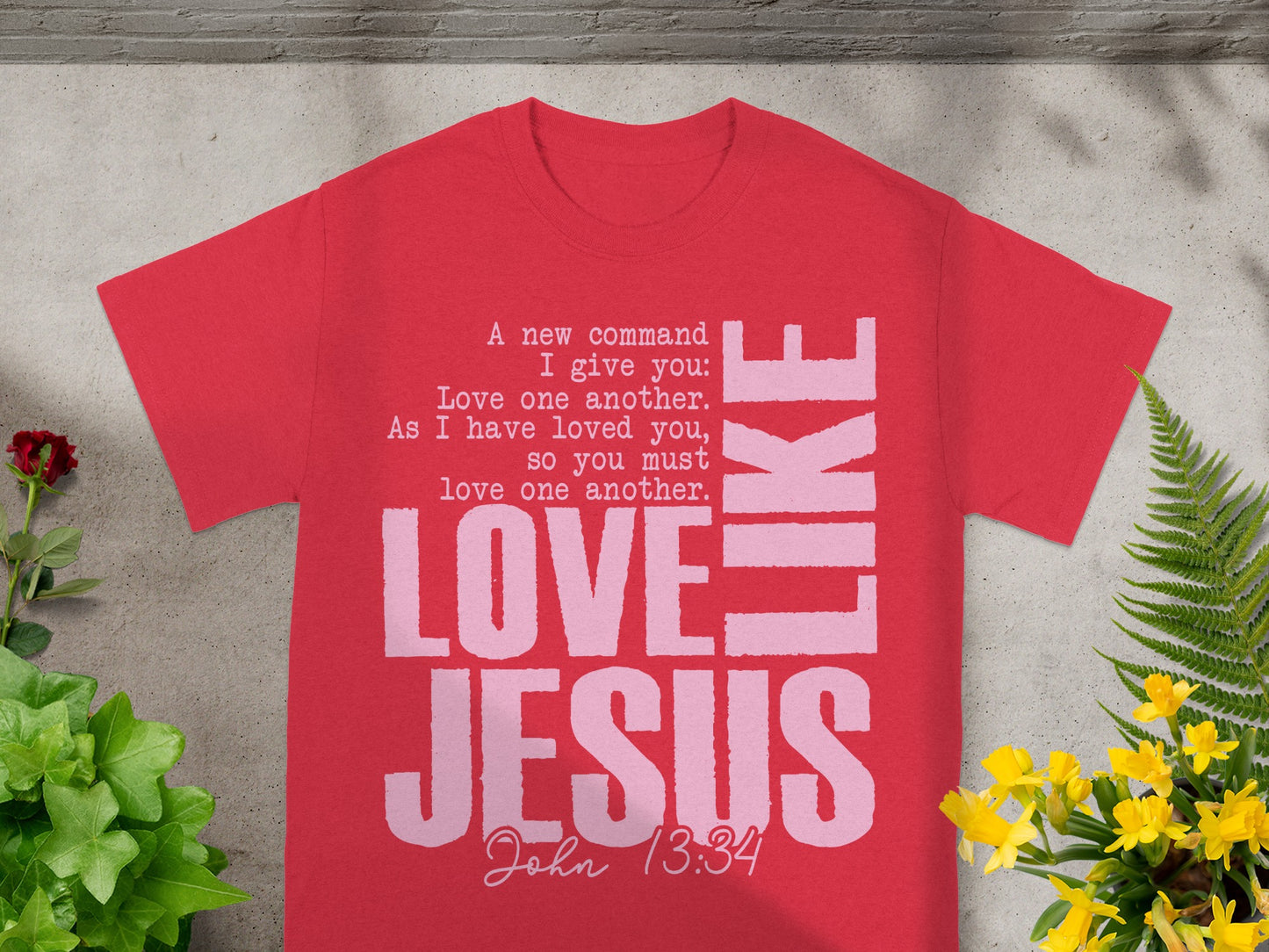 Red t-shirt with "LOVE JESUS" and biblical quote from John 13:34.
