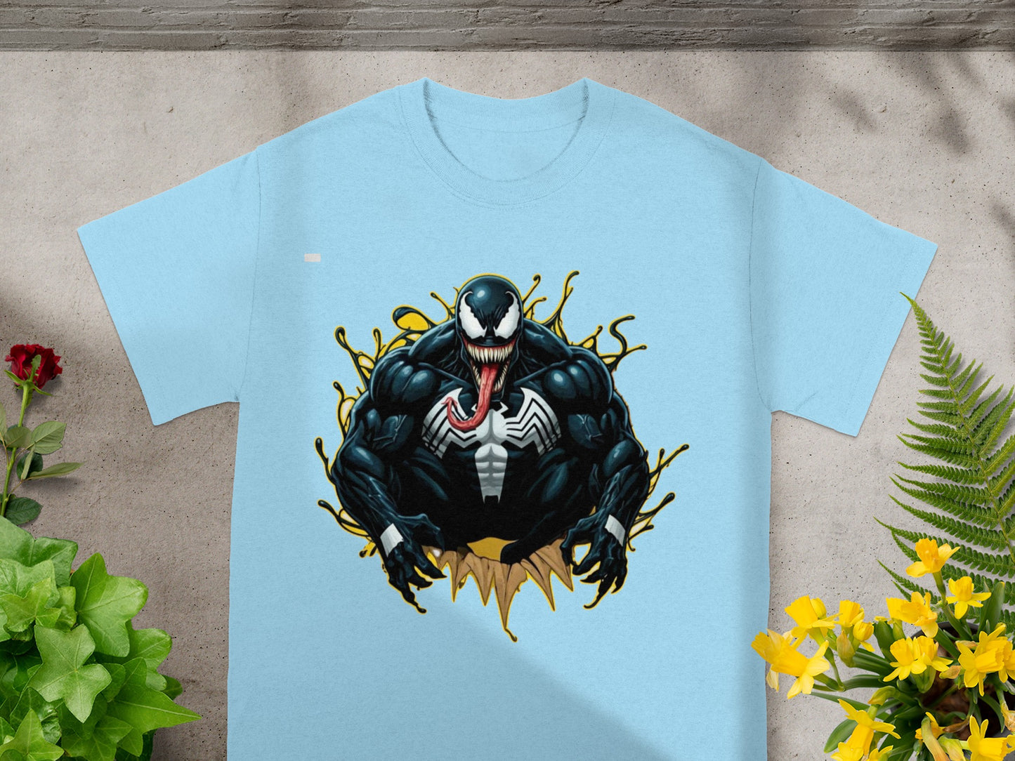 Light blue t-shirt featuring Venom artwork with yellow splash effects.