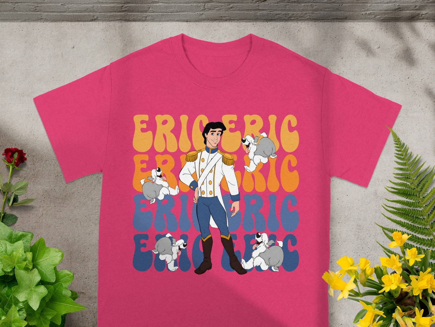 Prince Eric and Max surround a pink t-shirt with text.