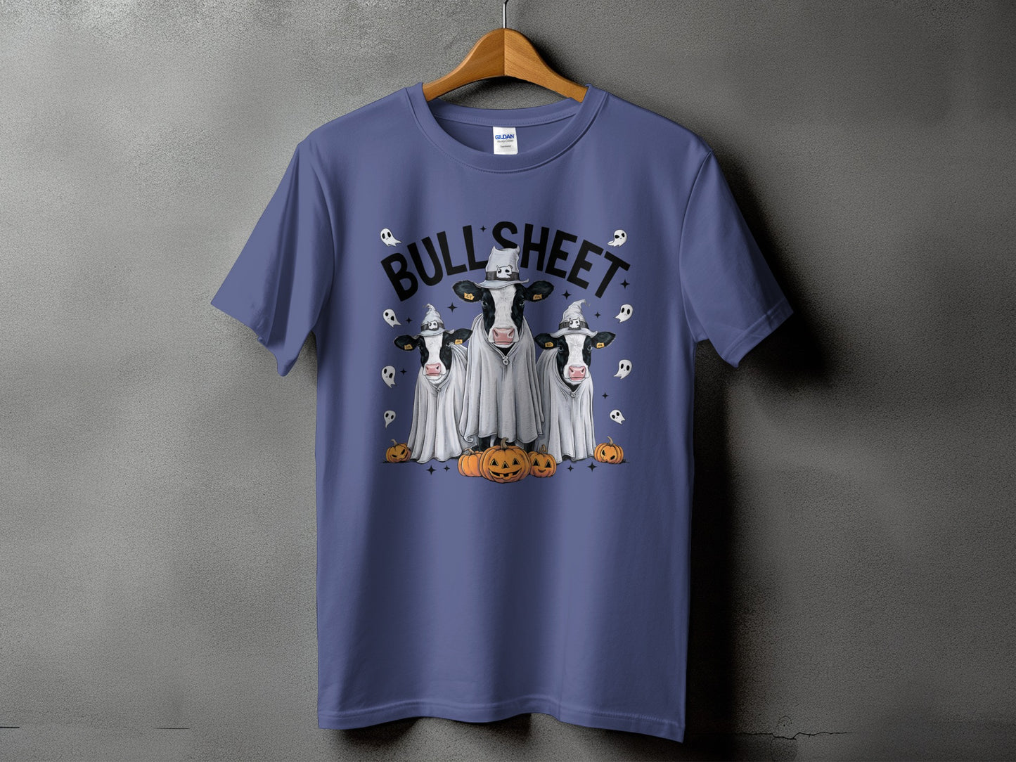 T-shirt with "BULL SHEET" text and three cows dressed as ghosts with pumpkins.