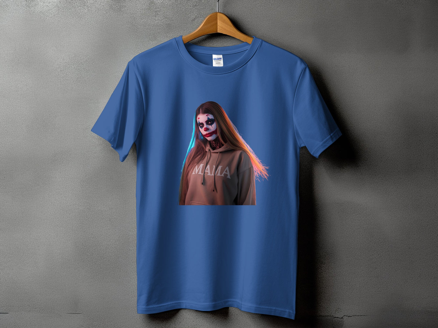 Blue t-shirt with a graphic of a person in clown makeup wearing a hoodie with "MAMA" text.