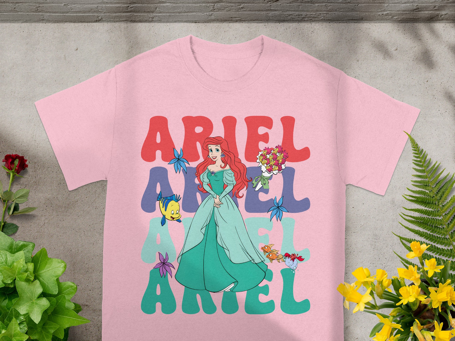 Pink t-shirt with Ariel graphic and "Ariel" text.