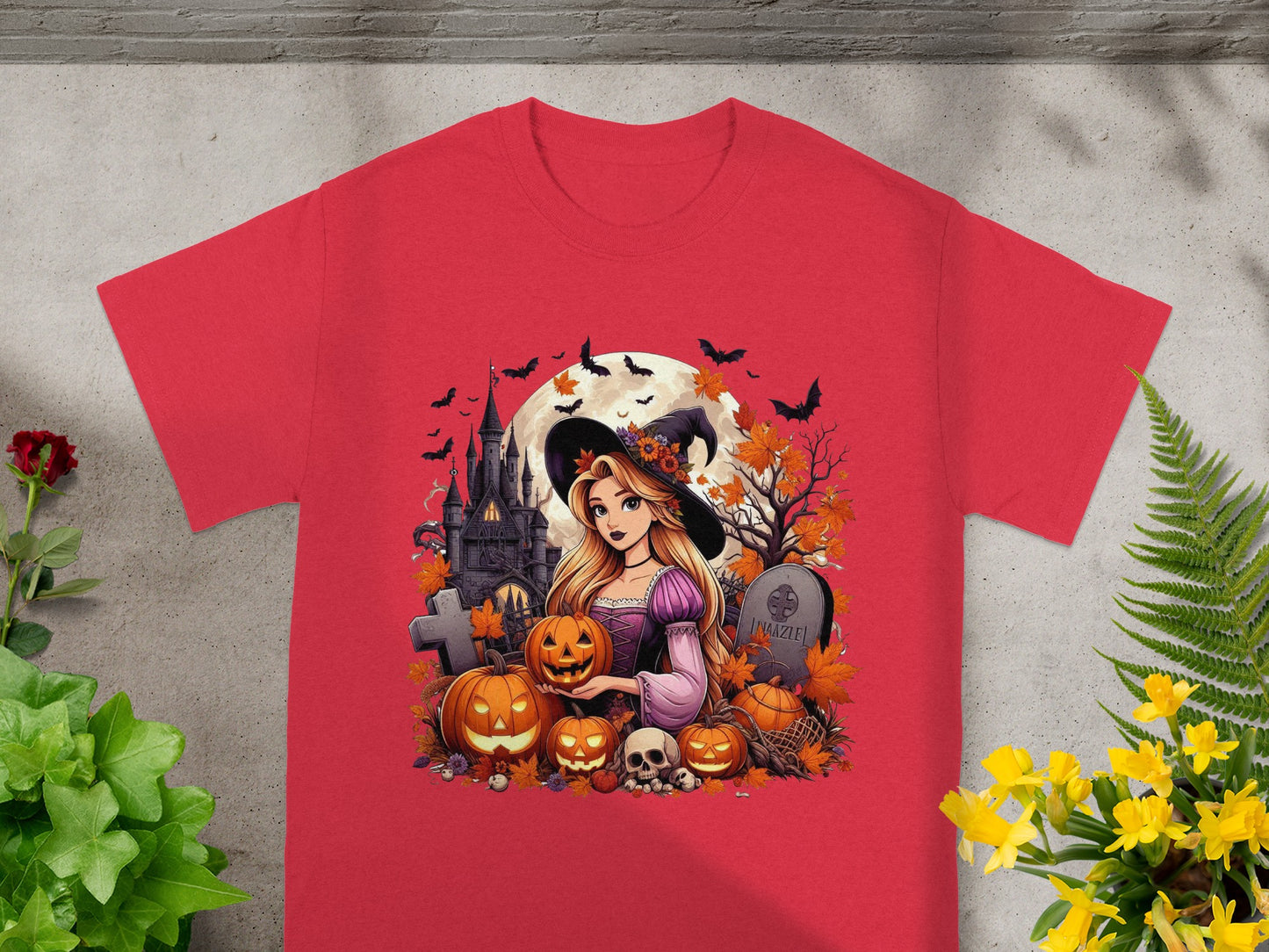 Red t-shirt with Halloween graphic of a witch, pumpkins, castle, and bats.