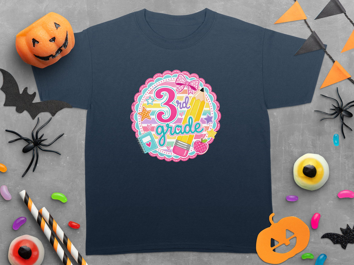 Dark navy t-shirt with "3rd Grade" circular graphic featuring a pink bow and yellow pencil.