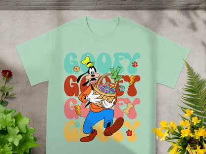 Goofy with Easter basket and text "GOOFY" on a mint green t-shirt.