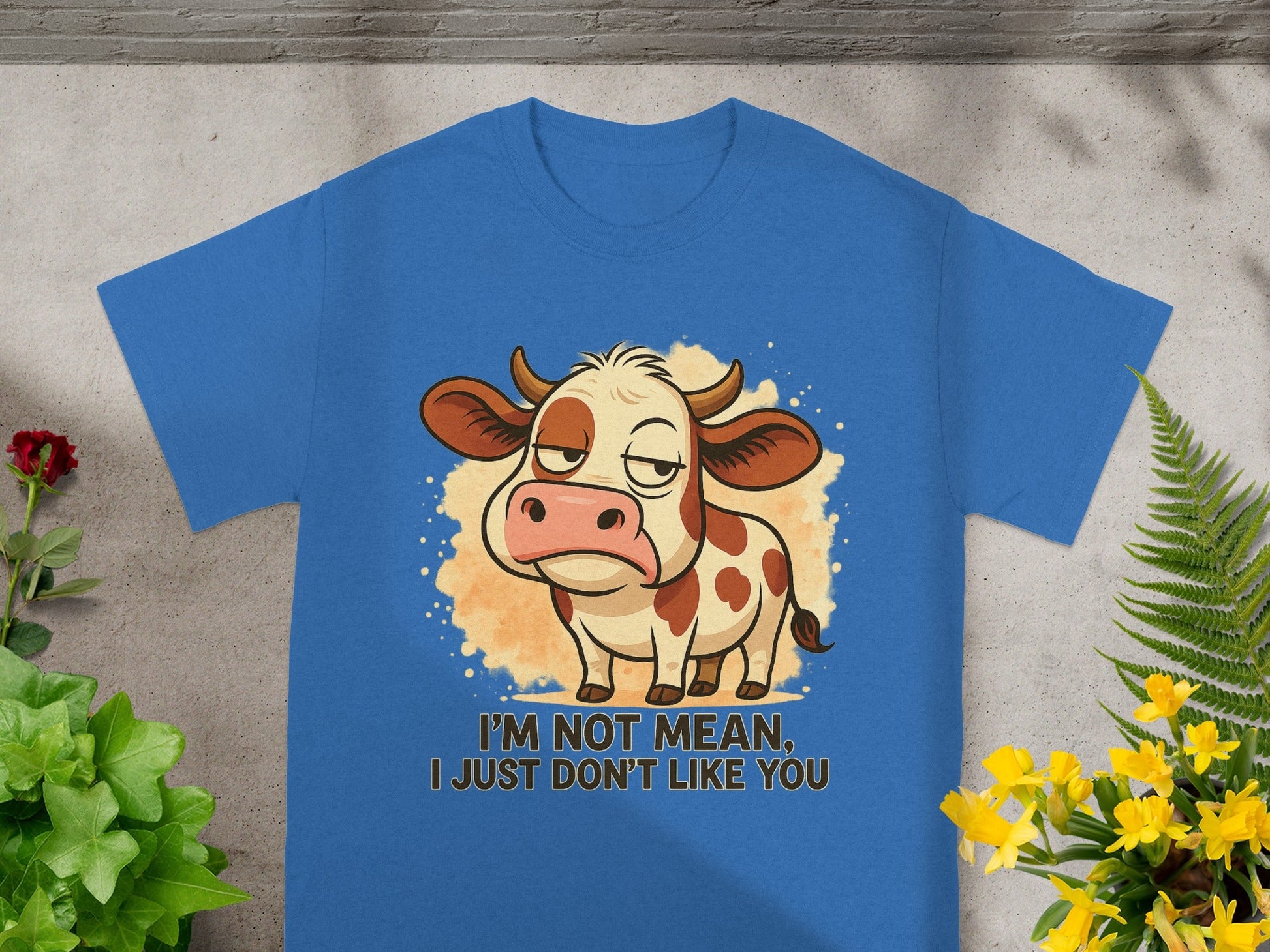 Blue t-shirt with cartoon cow saying "I'm not mean, I just don't like you".