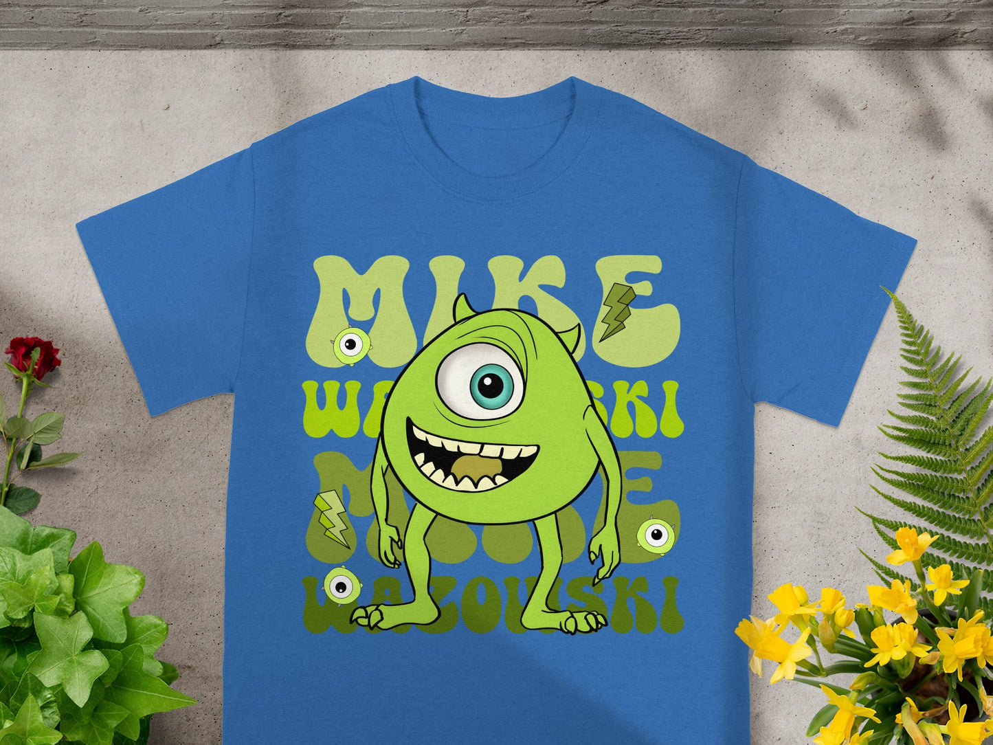 Blue t-shirt with green cartoon character "MIKE WAZOWSKI" text.