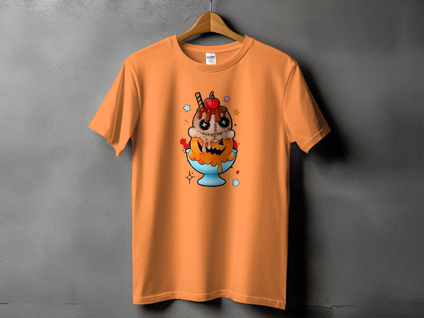 Orange t-shirt with a cartoon pumpkin ice cream sundae graphic.