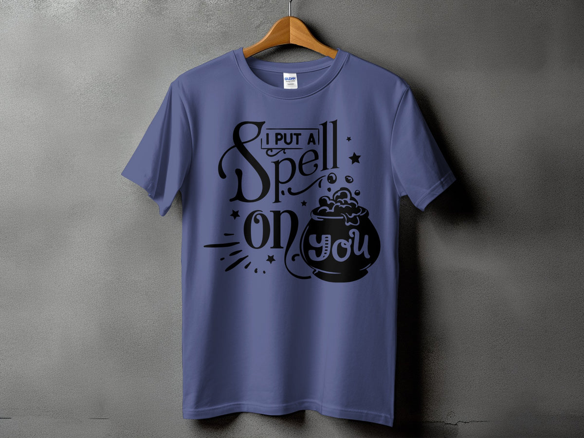 Purple t-shirt with "I Put A Spell On You" text and cauldron graphic.