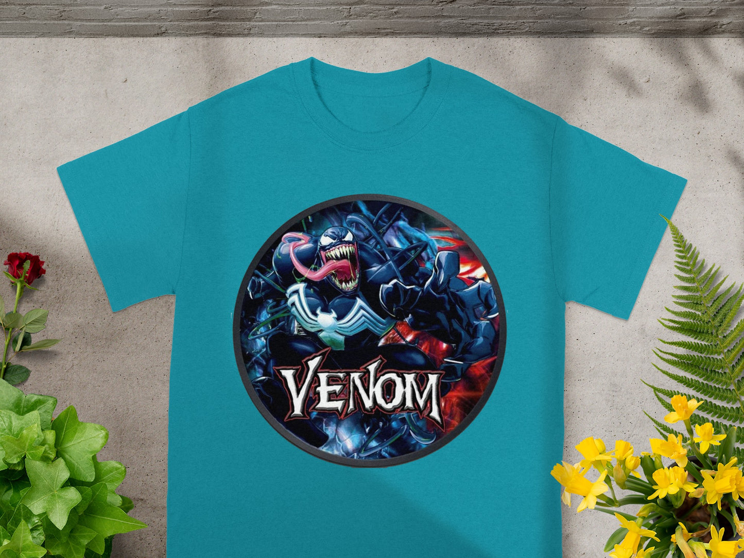 Teal t-shirt with a Venom comic art graphic on the chest.
