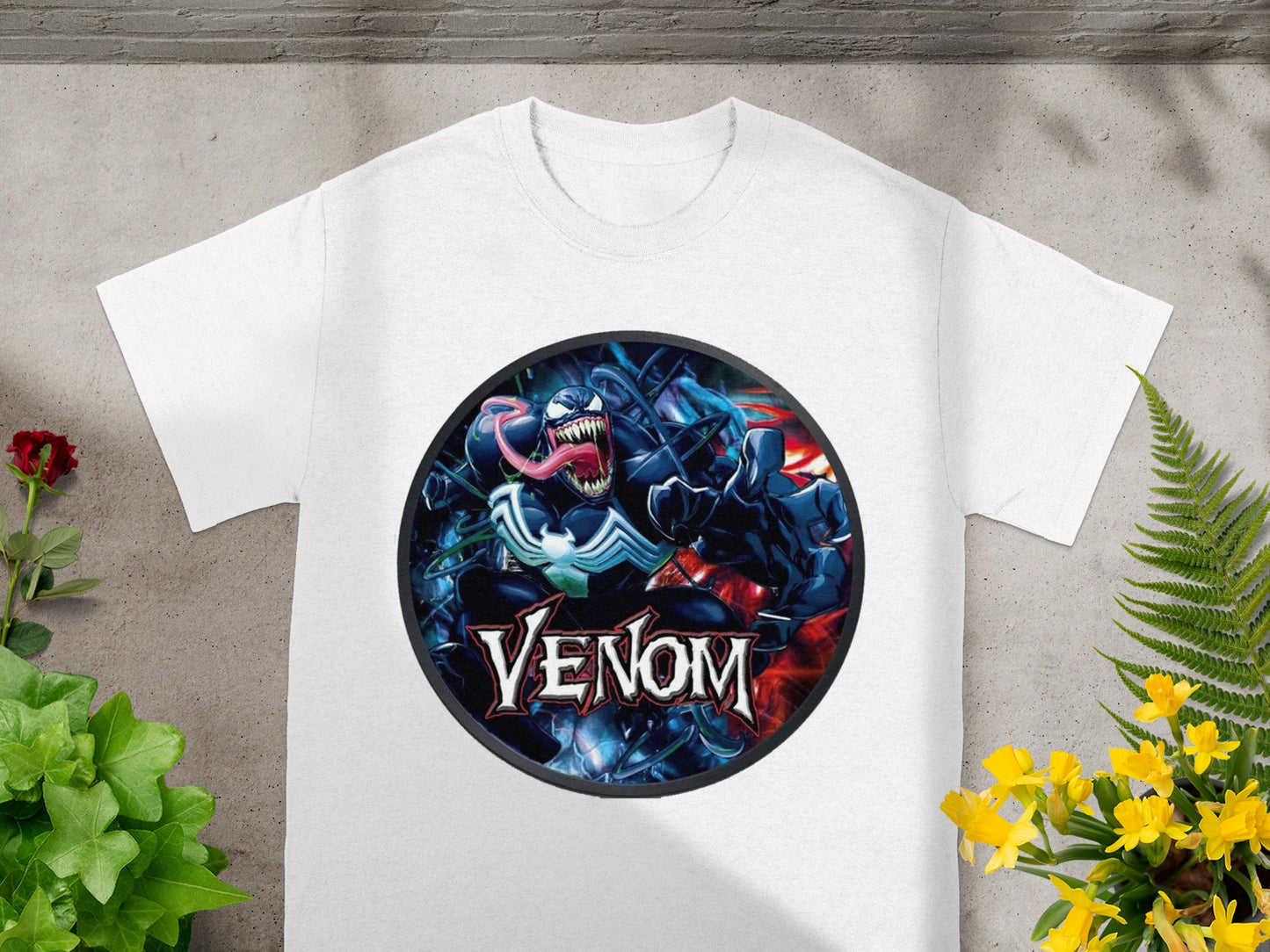 White t-shirt featuring a Venom comic book character graphic with the text "Venom".