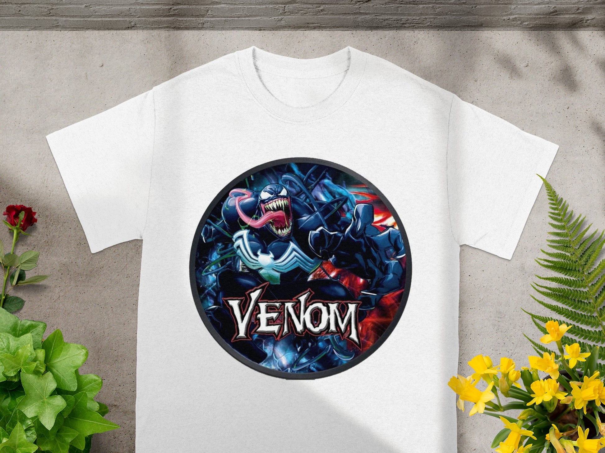 White t-shirt featuring a Venom comic book character graphic with the text "Venom".