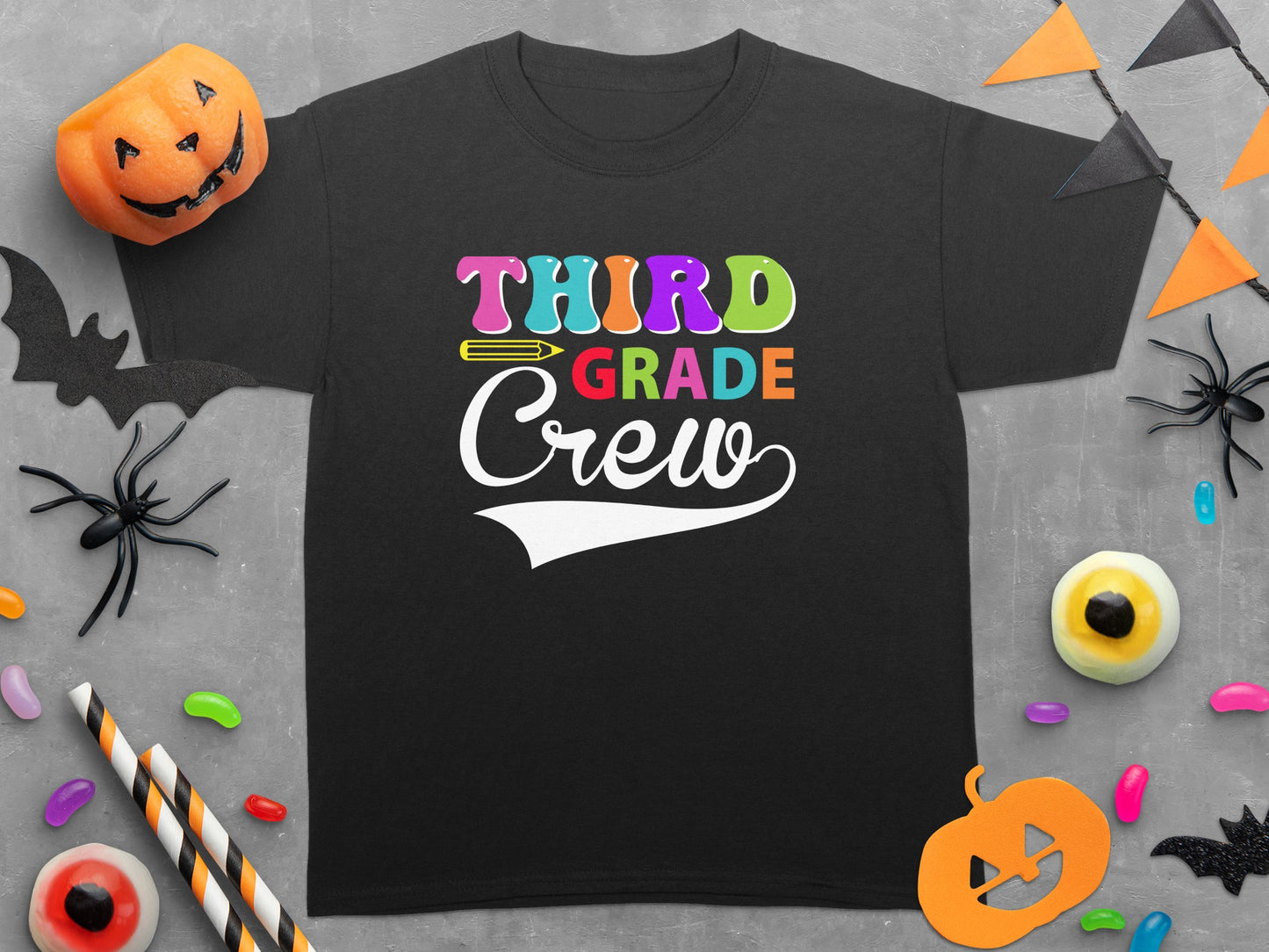 Black T-shirt with multicolor "Third Grade Crew" text and Halloween decorations.