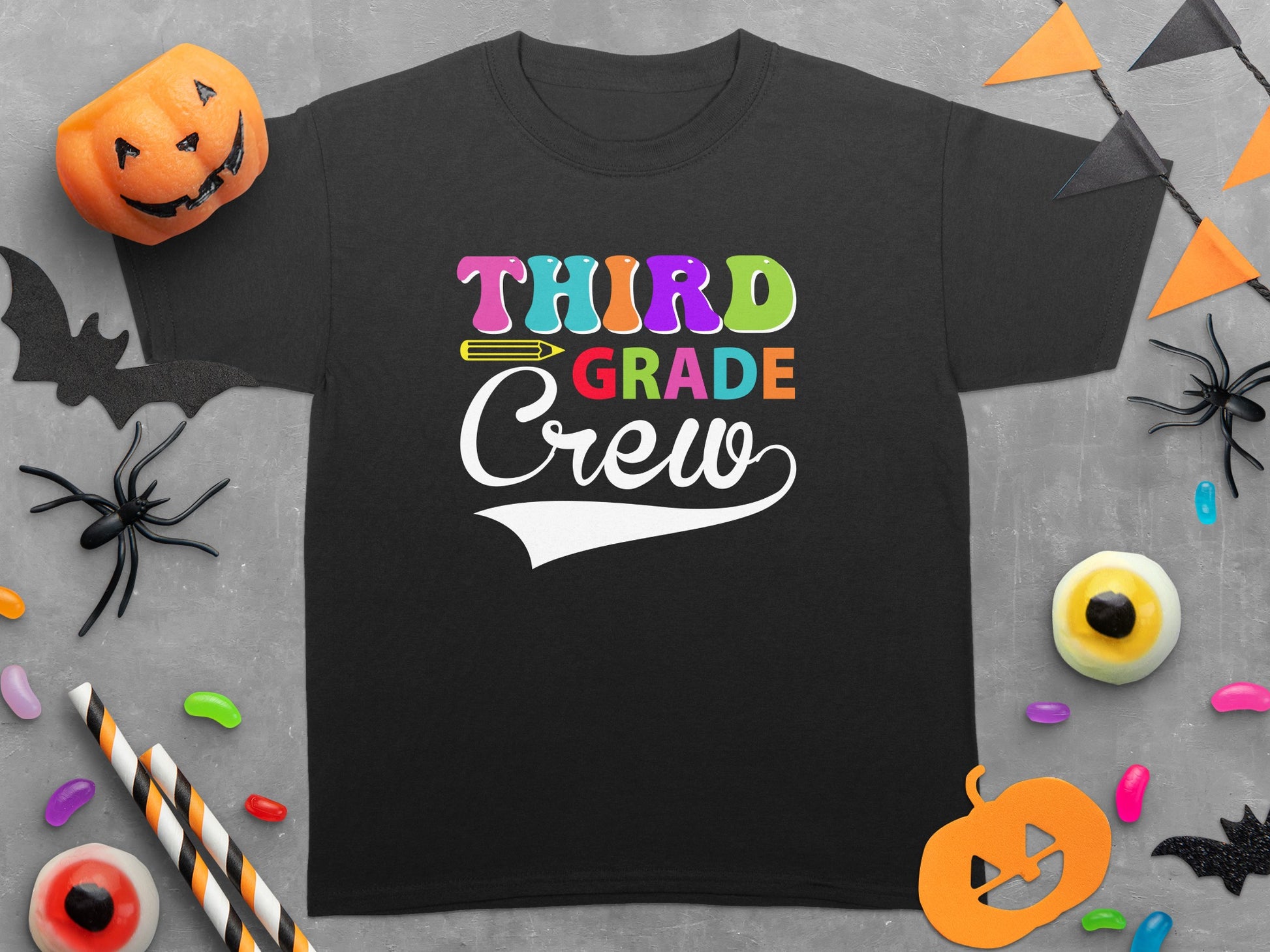 Black T-shirt with multicolor "Third Grade Crew" text and Halloween decorations.