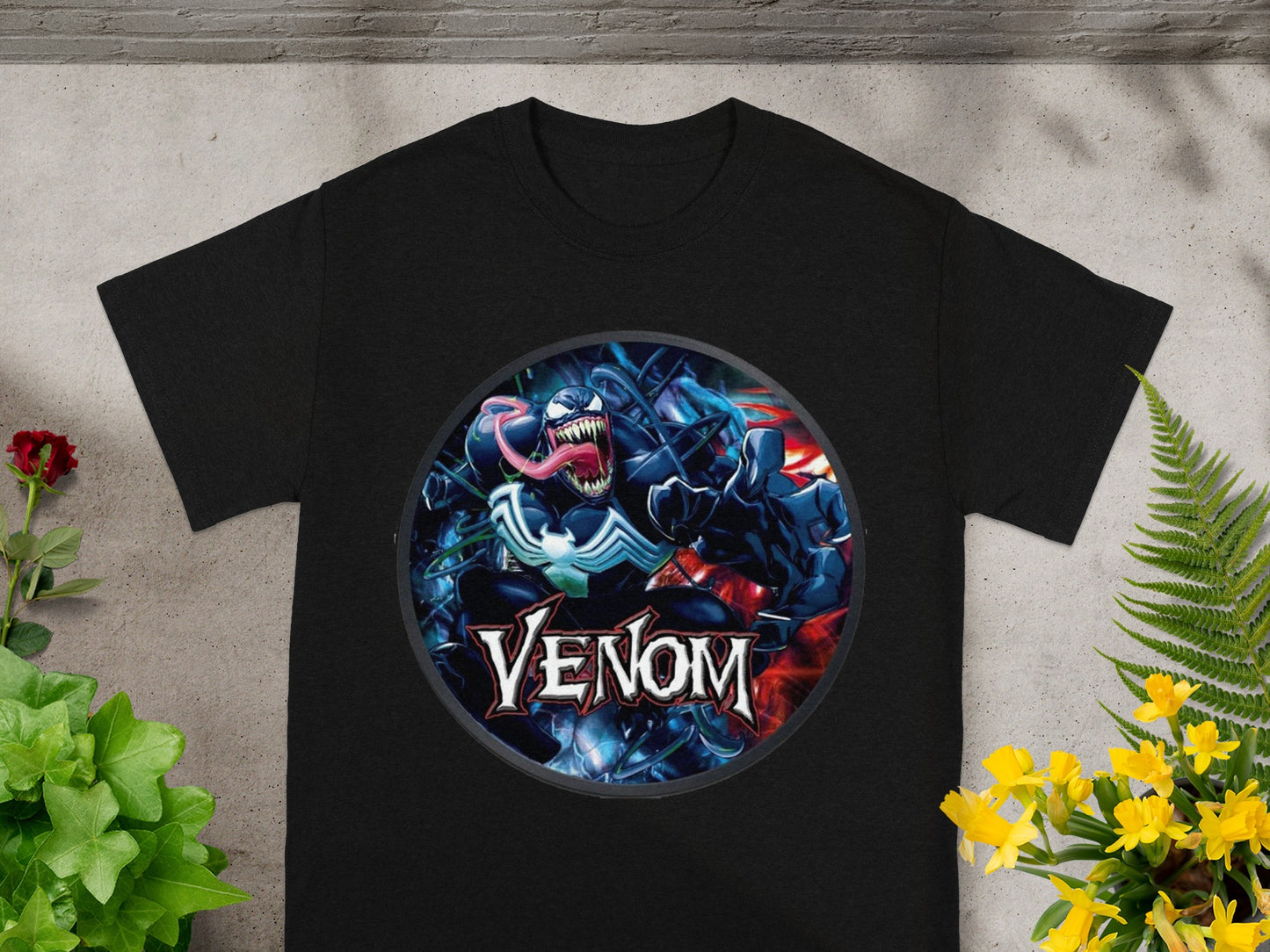 Black t-shirt featuring Venom's face with red and blue accents.