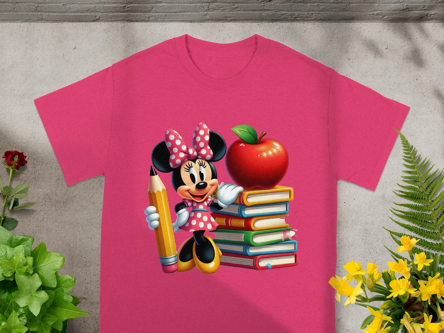 Minnie Mouse holding a pencil next to a stack of books topped with an apple.
