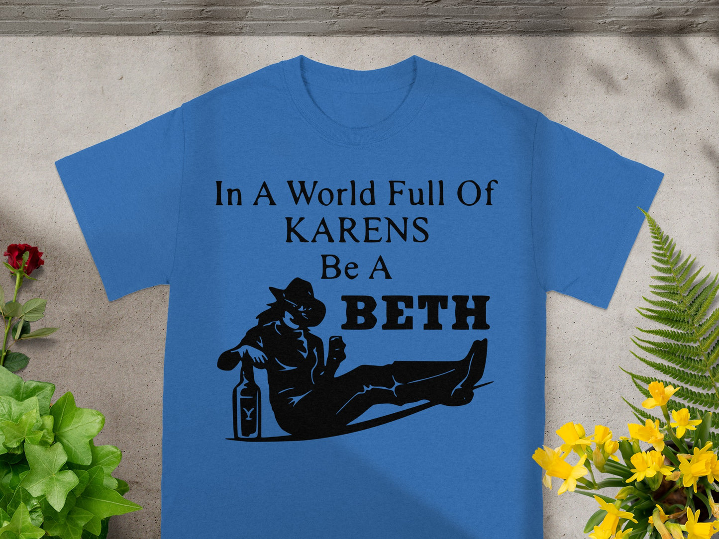 Blue t-shirt with "In A World Full Of KARENS Be A BETH" text and silhouette.