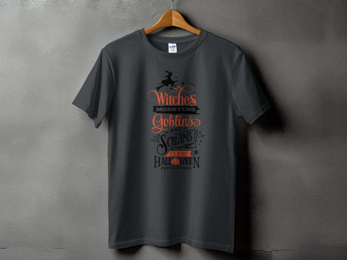 Dark grey t-shirt with text: Witches, Monsters, Goblins, and Screams. It's Almost Halloween.