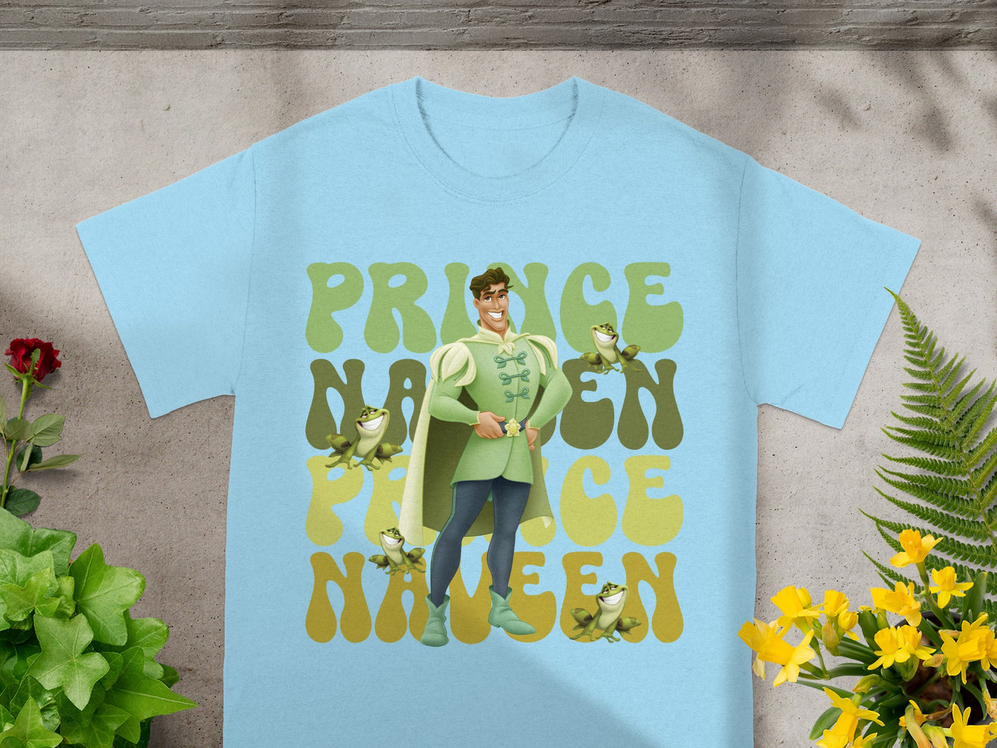 Light blue t-shirt featuring Prince Charming and the words "Prince Charming" in a groovy font.