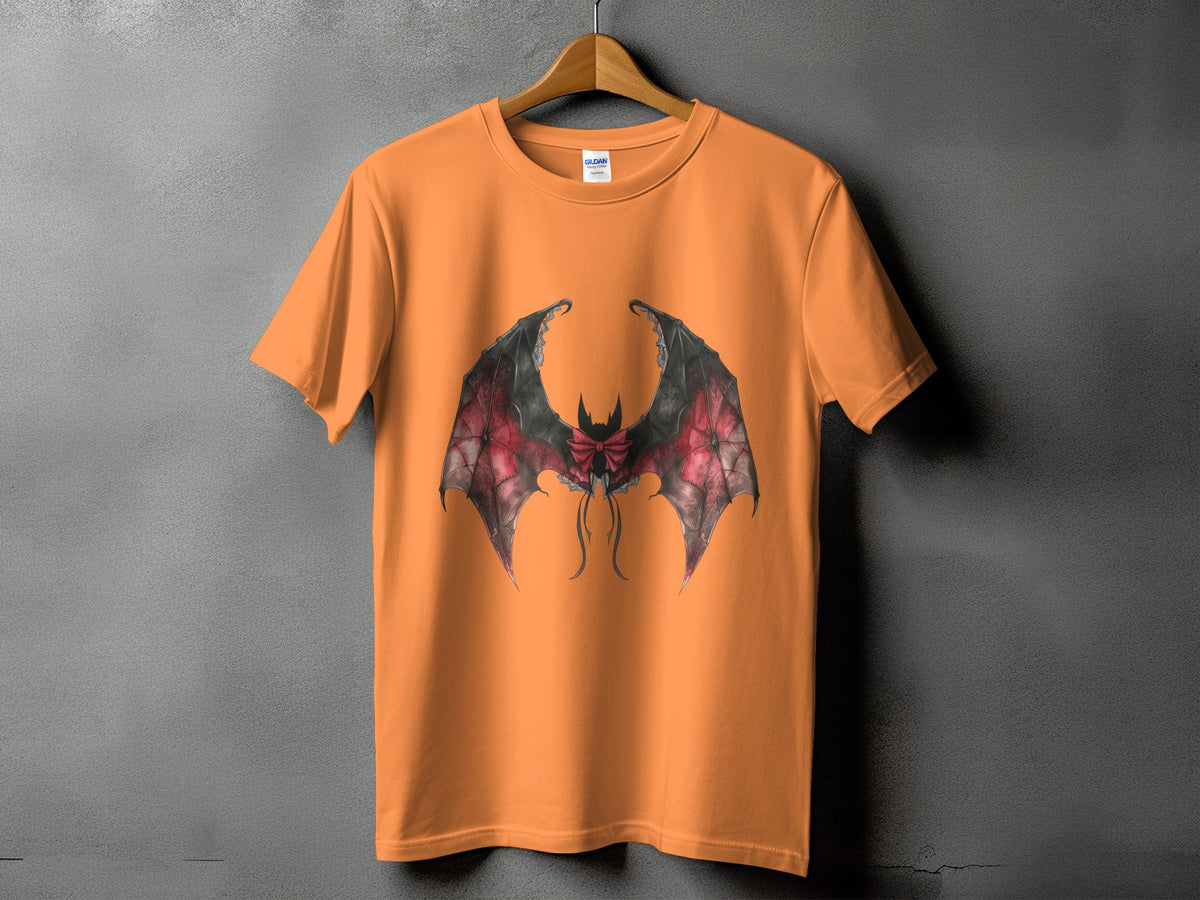 Orange t-shirt with a black and red bat wing graphic and bow detail.
