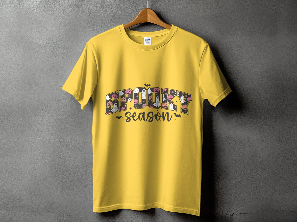 Yellow t-shirt with "SPOOKY season" text featuring Halloween motifs.