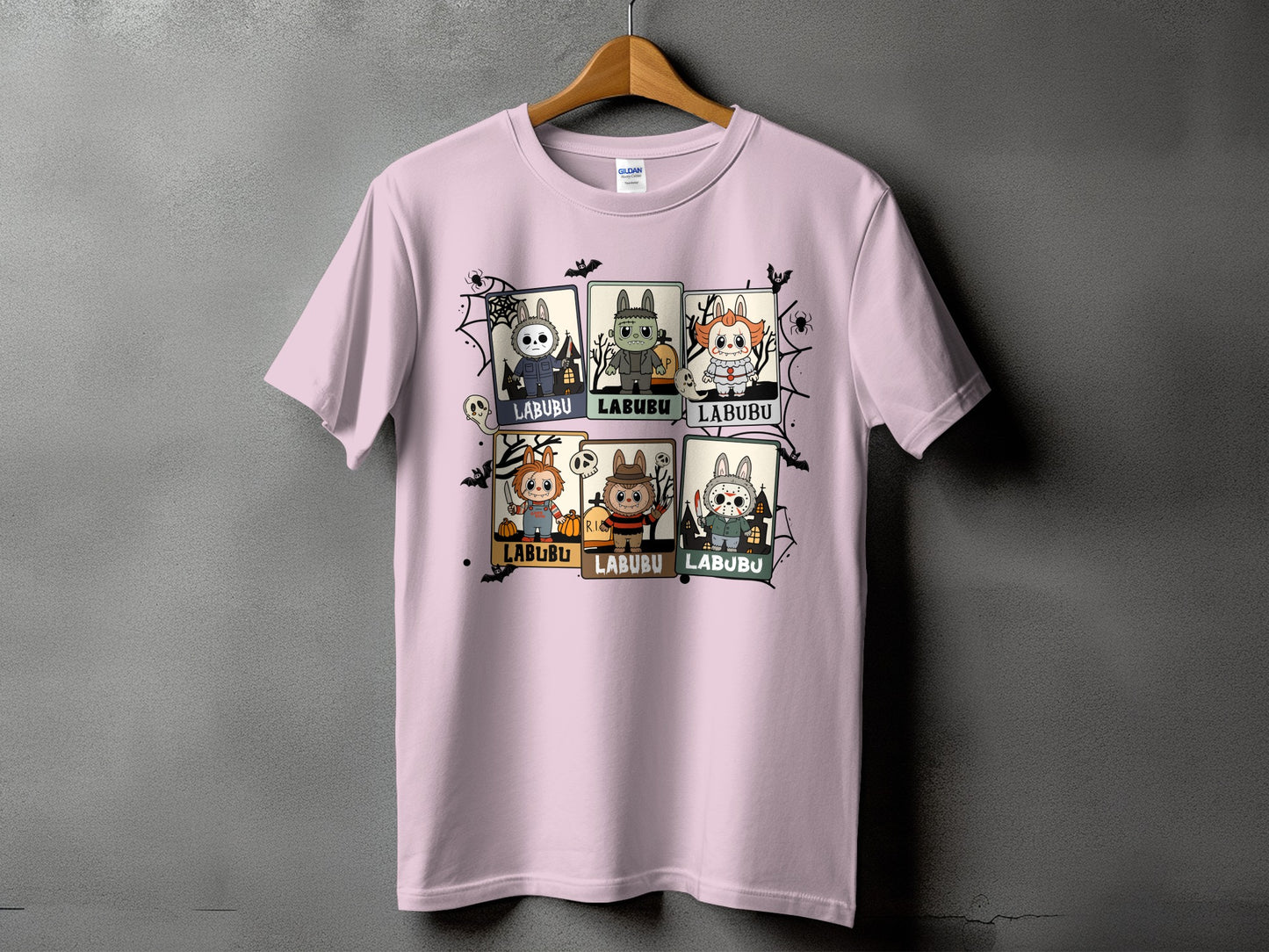 Pink t-shirt with six Halloween character illustrations, each labeled "LABUBU".