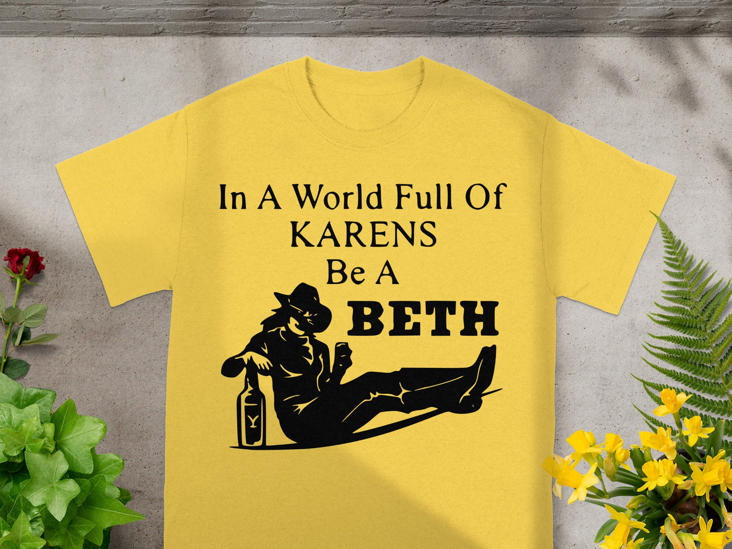 Yellow t-shirt with text "In a world full of Karens be a Beth" and silhouette.