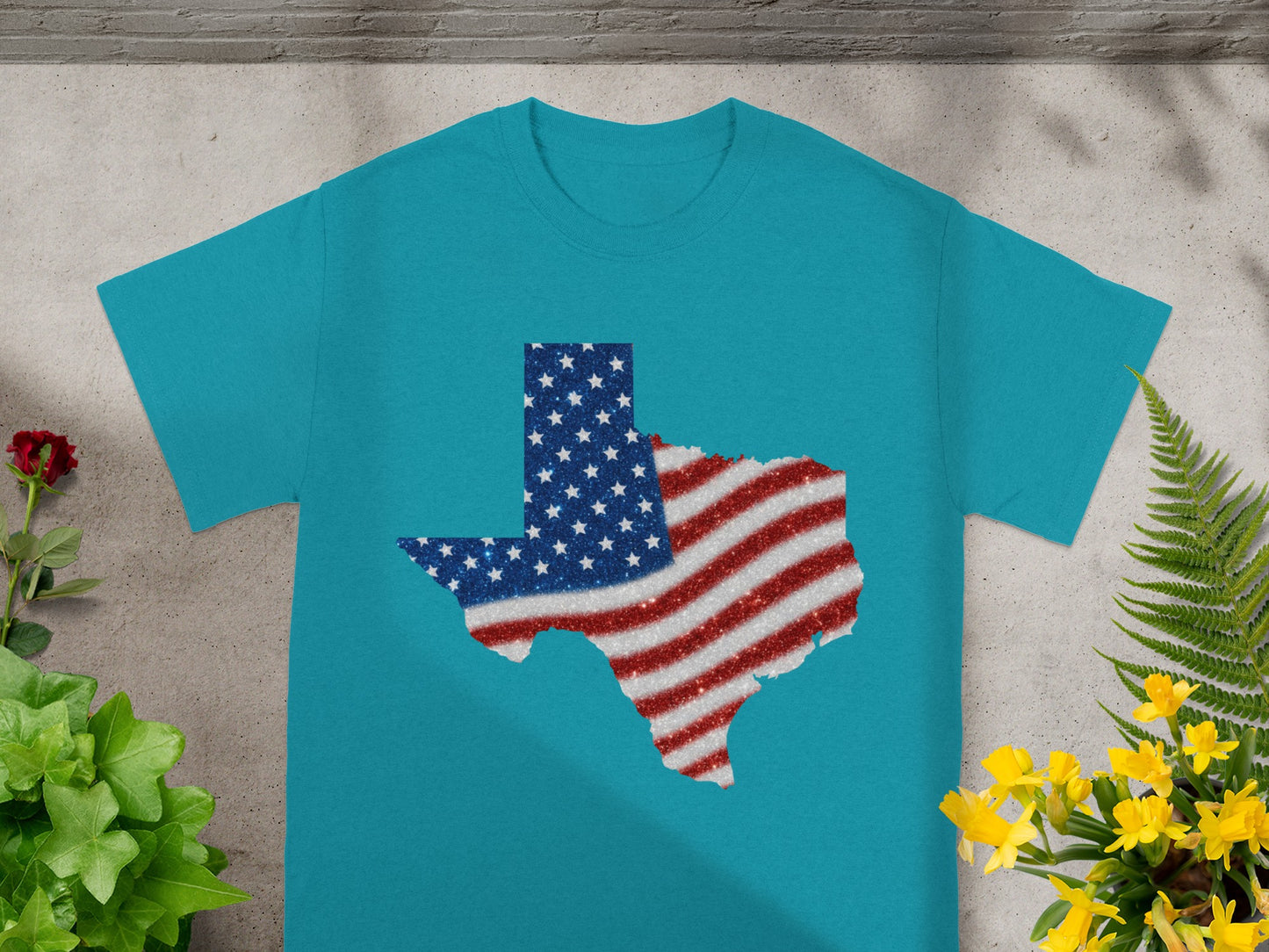 Teal t-shirt with a glittering Texas shape filled with the US flag.