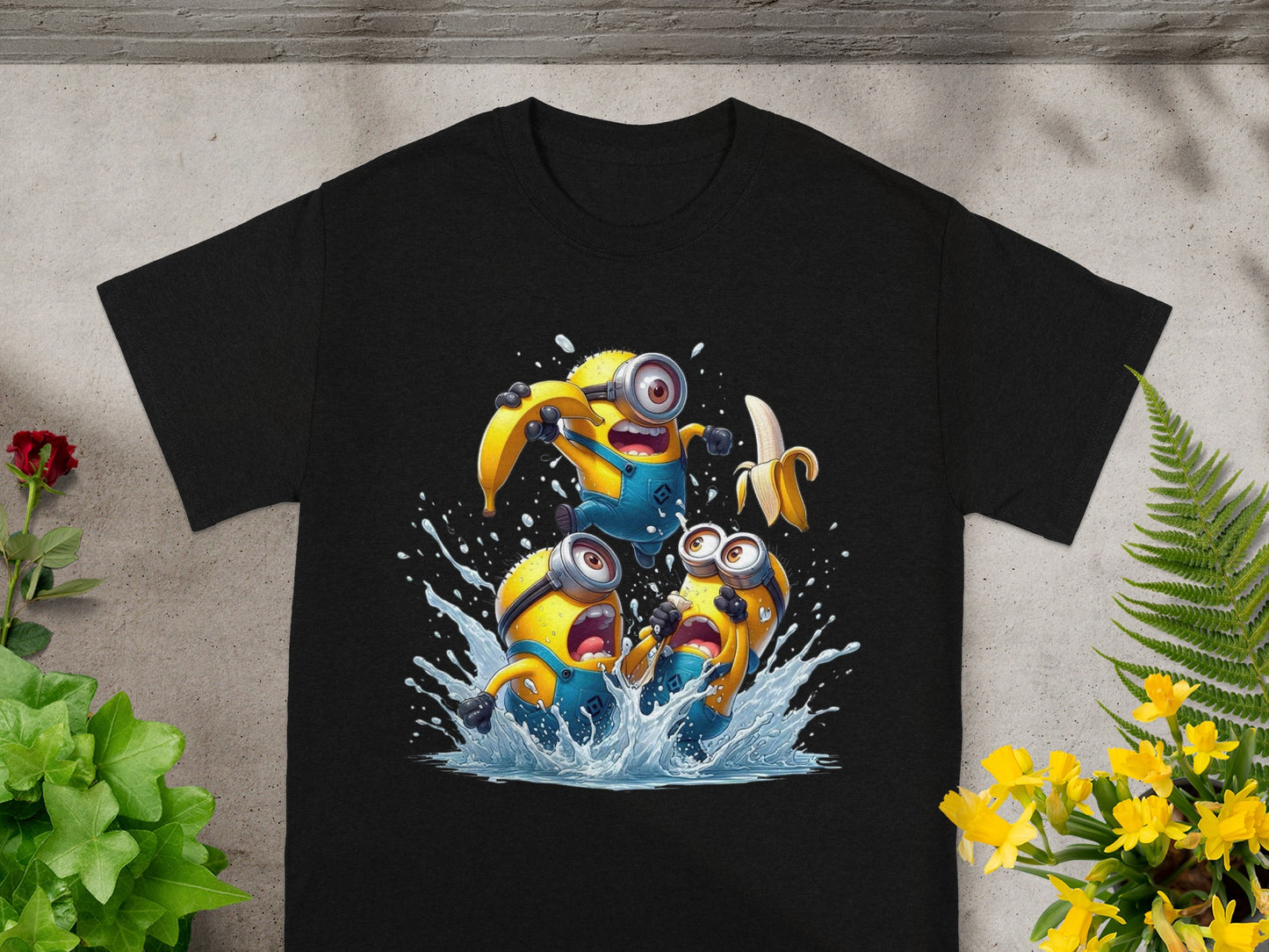 Black t-shirt featuring three Minions splashing in water with bananas.