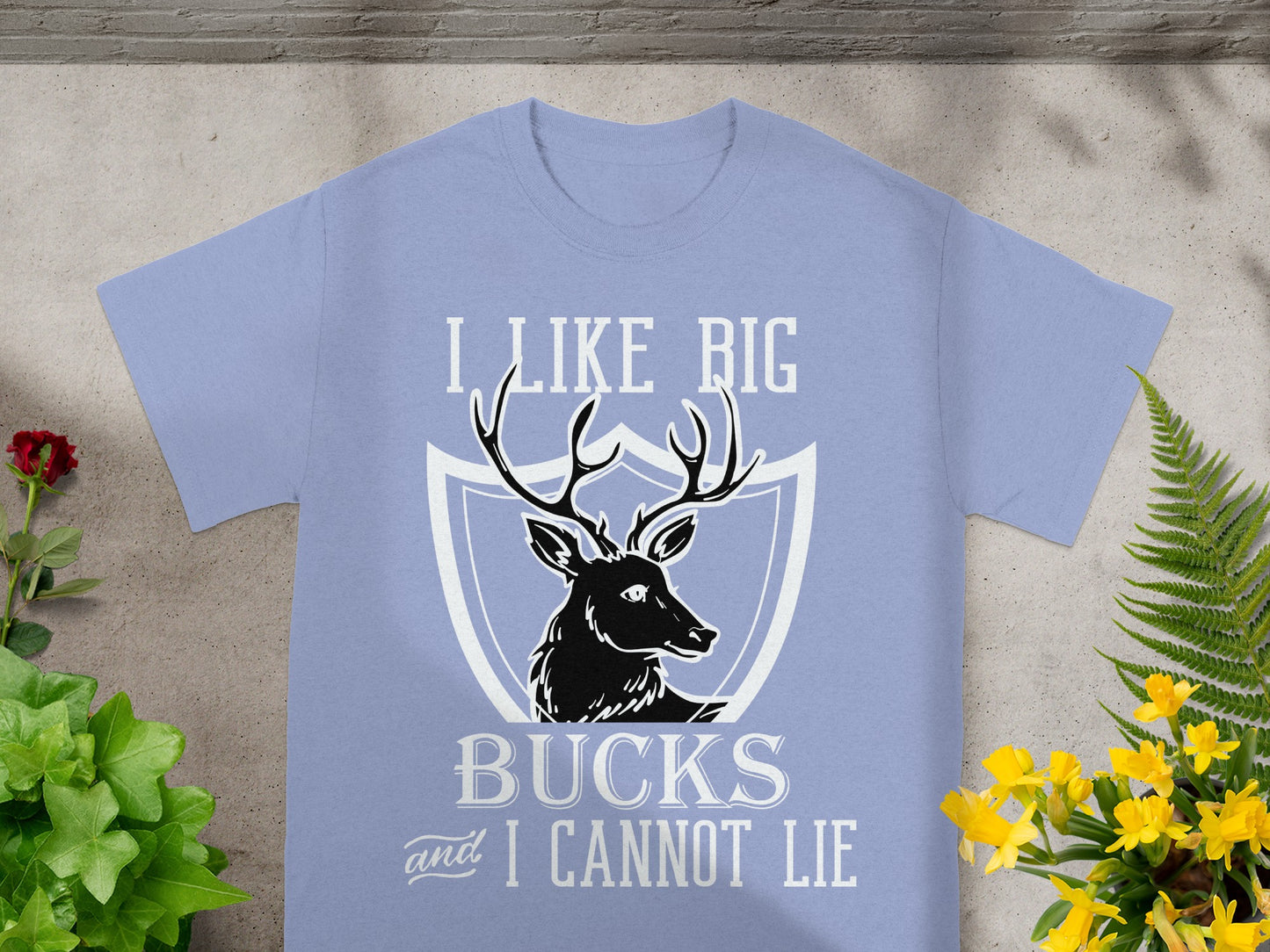 Periwinkle t-shirt with black deer graphic and "I like big bucks and I cannot lie."