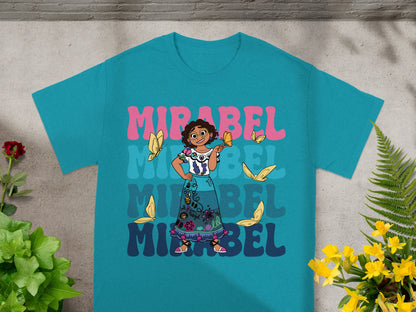Mirabel from Encanto on a teal t-shirt with colorful butterflies and text.