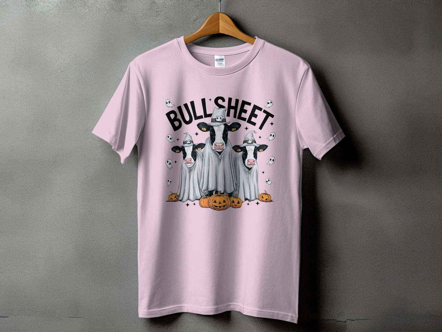 Pink t-shirt with three cows dressed as ghosts and "BULL SHEET" text.