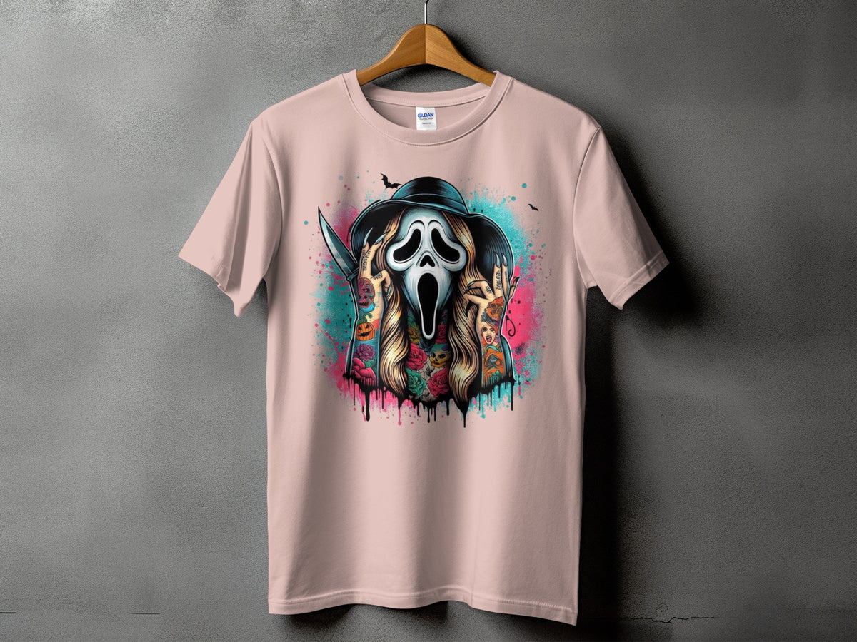Pink t-shirt with a tattoo-style Scream mask, knife, and Halloween imagery.