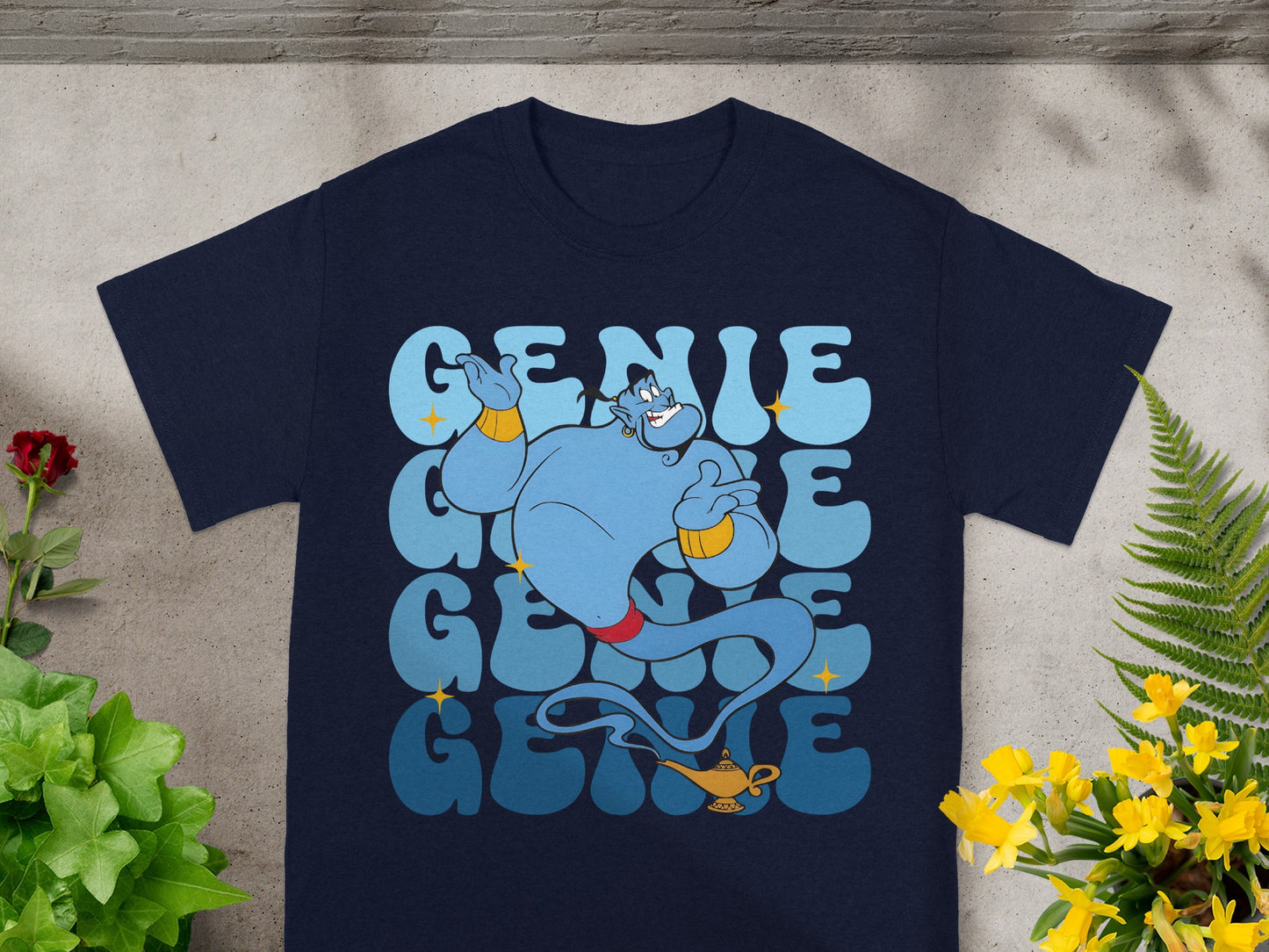 Navy t-shirt with "GENIE" in large blue lettering and a genie illustration.