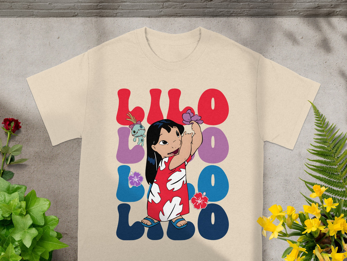 Lilo & Stitch graphic t-shirt with Lilo character and Hawaiian flowers.