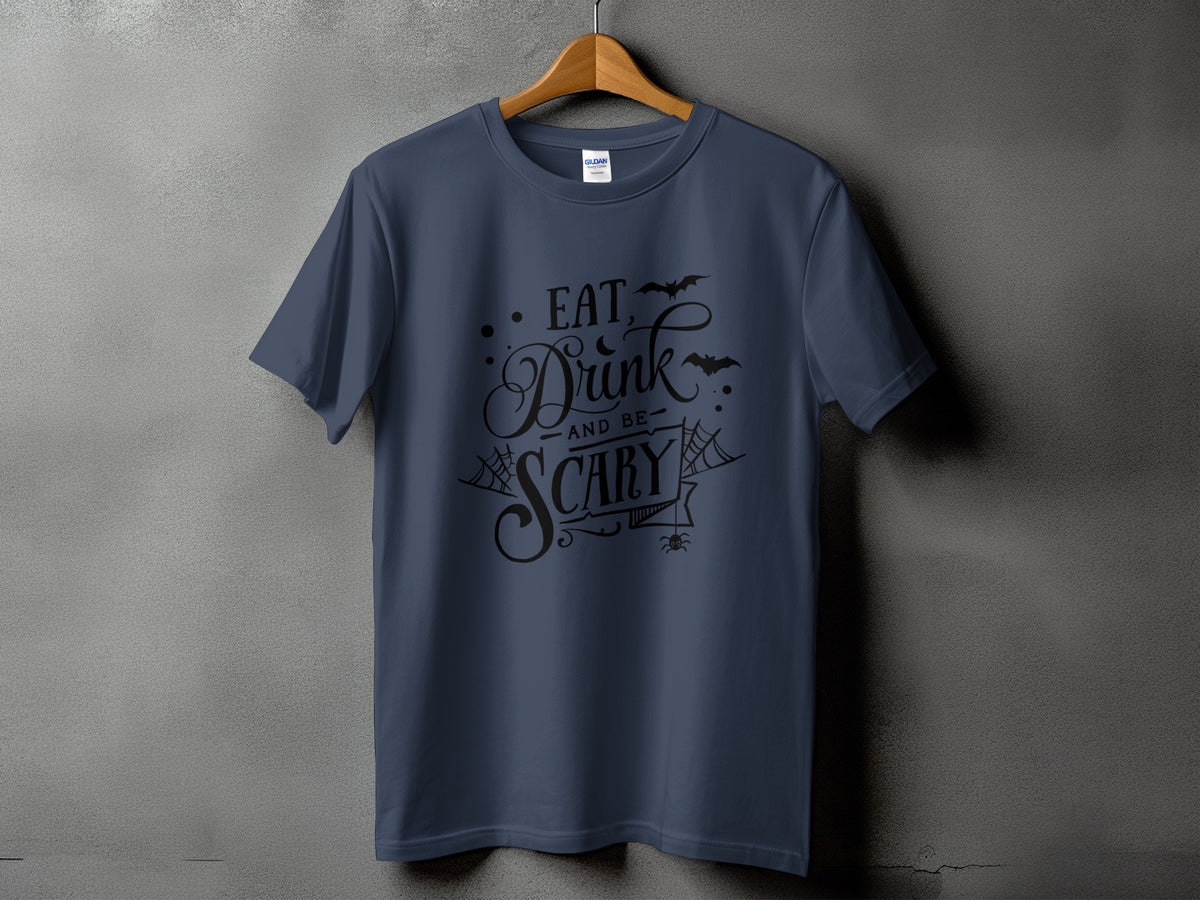 Dark blue t-shirt with black text reading "Eat, Drink and be Scary" and Halloween graphics.