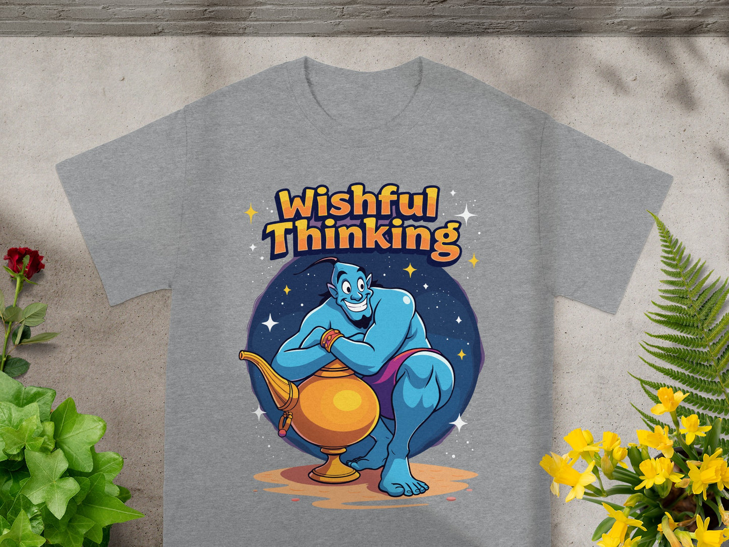 Genie with lamp on t-shirt reads "Wishful Thinking" surrounded by stars.