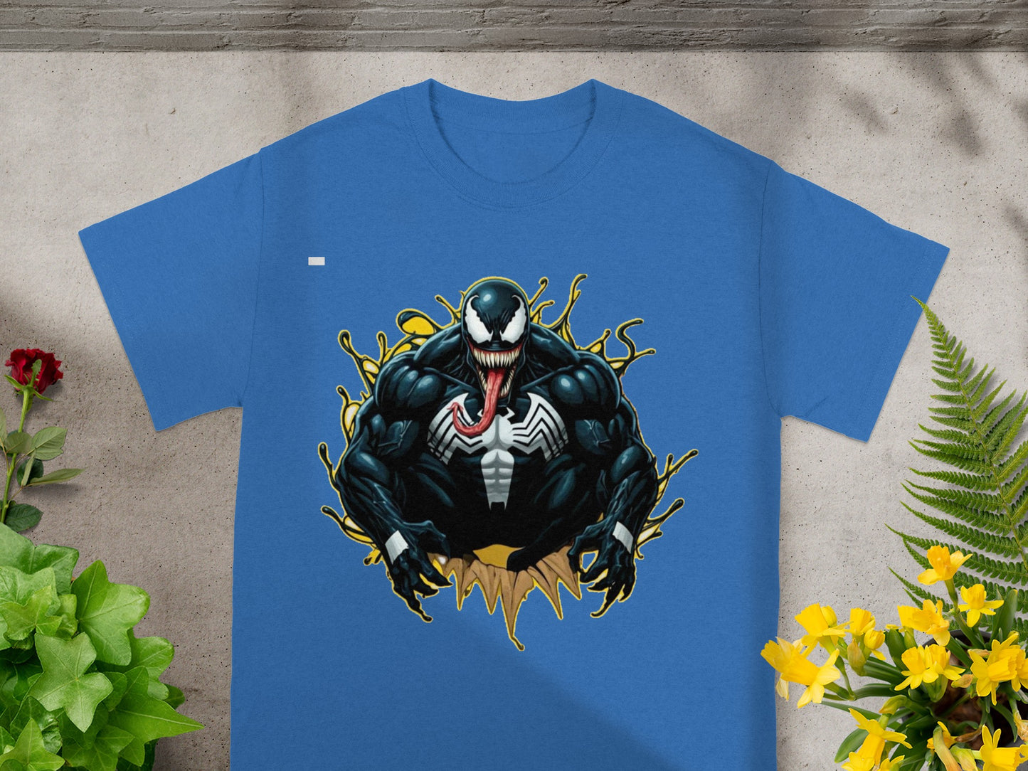 Blue t-shirt with Venom graphic and yellow splatter effect.